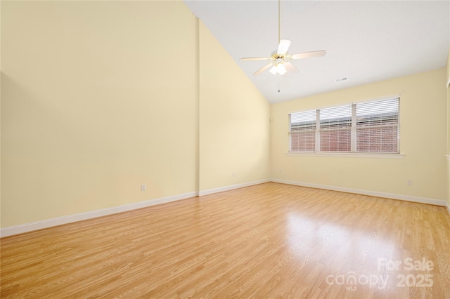 unfurnished room featuring ceiling fan, visible vents, baseboards, high vaulted ceiling, and light wood-style floors