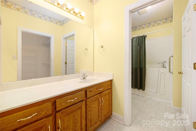 bathroom featuring vanity, curtained shower, baseboards, a bath, and tile patterned floors