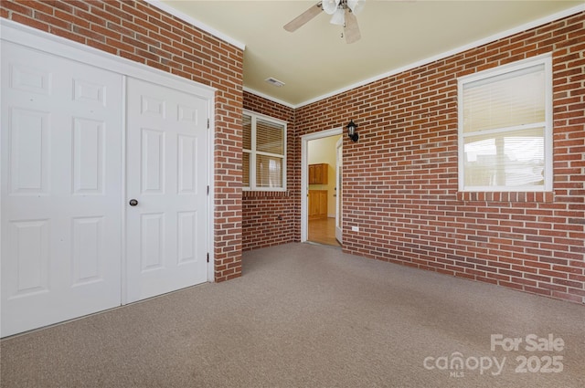 view of patio featuring a ceiling fan