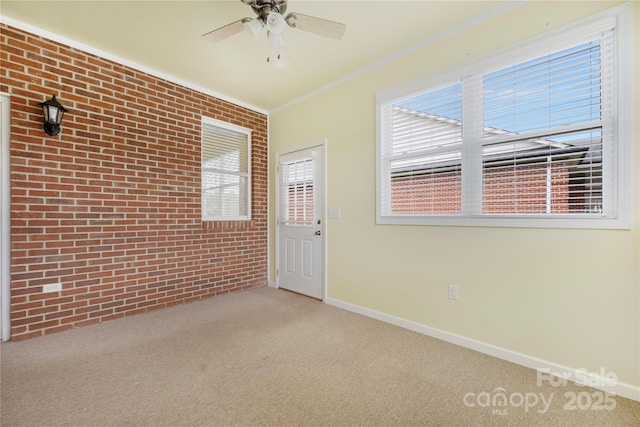 unfurnished room featuring baseboards, plenty of natural light, and carpet flooring