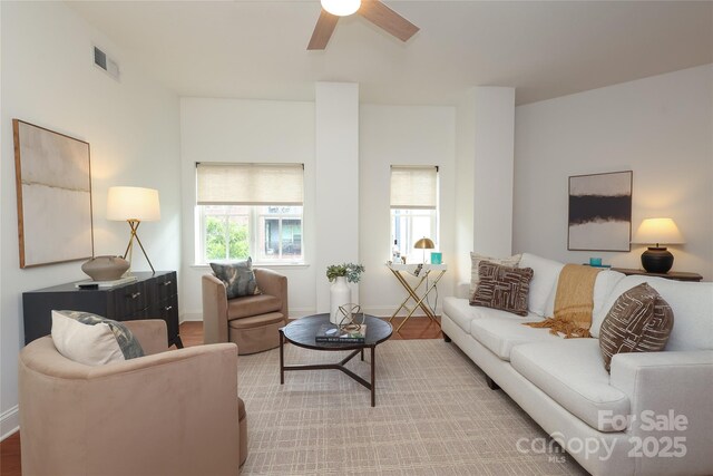 721 Governor Morrison St Unit 520, Charlotte, NC 28211 - living area with a ceiling fan, wood finished floors, and baseboards
