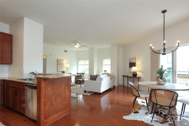 721 Governor Morrison St Unit 520, Charlotte, NC 28211 - kitchen with dishwasher, a sink, dark wood-style flooring, and a chandelier