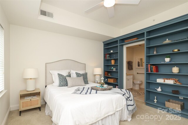 721 Governor Morrison St Unit 520, Charlotte, NC 28211 - bedroom with light carpet, ensuite bathroom, baseboards, and a ceiling fan
