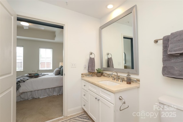 721 Governor Morrison St Unit 520, Charlotte, NC 28211 - bathroom featuring vanity, toilet, and ceiling fan