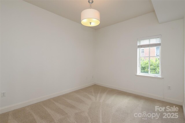 721 Governor Morrison St Unit 520, Charlotte, NC 28211 - unfurnished room featuring baseboards and light carpet