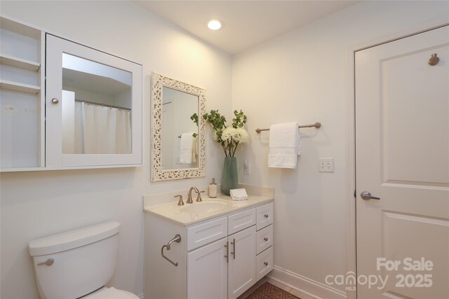 721 Governor Morrison St Unit 520, Charlotte, NC 28211 - bathroom featuring vanity, toilet, and recessed lighting