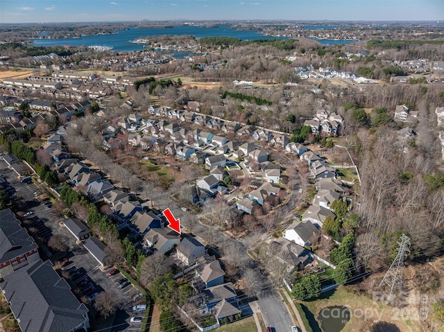 birds eye view of property featuring a residential view and a water view