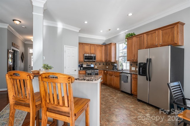 kitchen with brown cabinets, stainless steel appliances, recessed lighting, backsplash, and ornamental molding