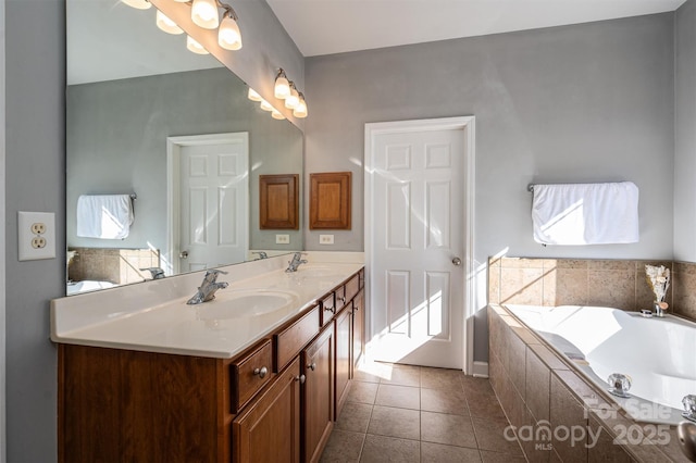 bathroom with double vanity, a sink, a bath, and tile patterned flooring