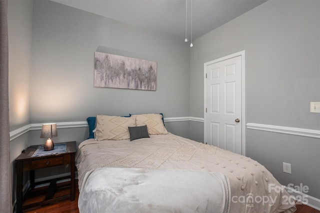 bedroom featuring wood finished floors