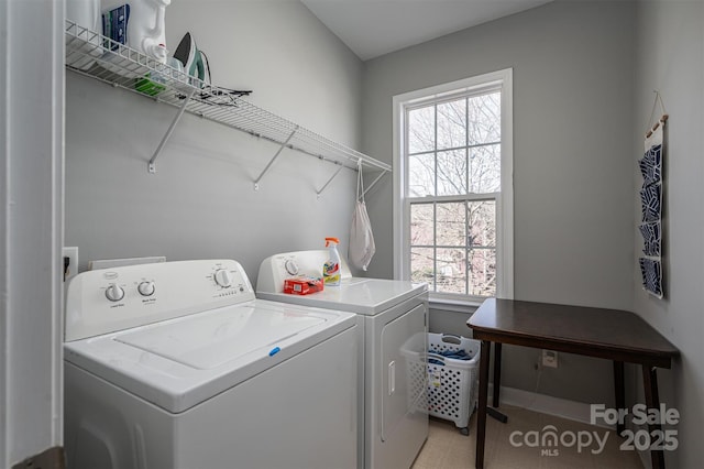 clothes washing area featuring laundry area and independent washer and dryer