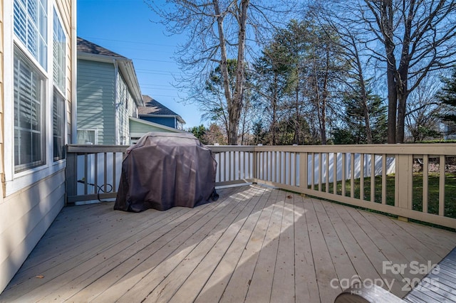 wooden deck with grilling area