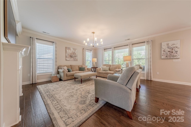 living area with crown molding, an inviting chandelier, a healthy amount of sunlight, and dark wood finished floors