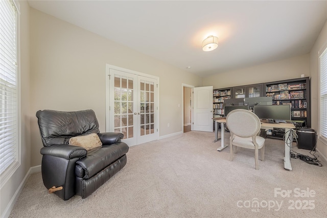 office with french doors, carpet, and baseboards