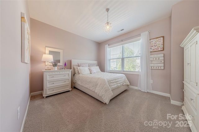 bedroom featuring carpet floors, baseboards, and visible vents