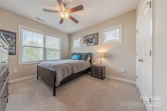 bedroom featuring light colored carpet, baseboards, and visible vents
