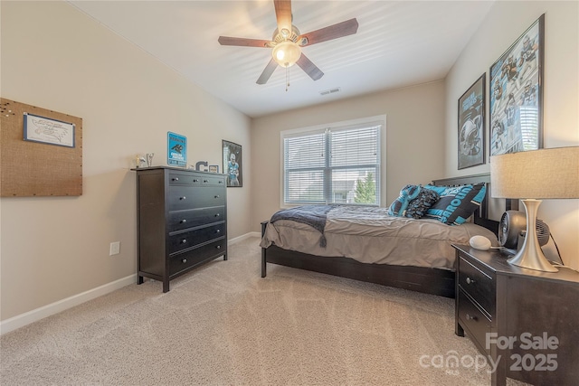bedroom with a ceiling fan, baseboards, light colored carpet, and visible vents