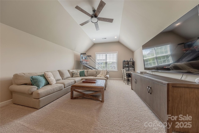 living area with light colored carpet, a ceiling fan, baseboards, recessed lighting, and lofted ceiling