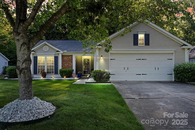 single story home with a garage, concrete driveway, a front lawn, and brick siding