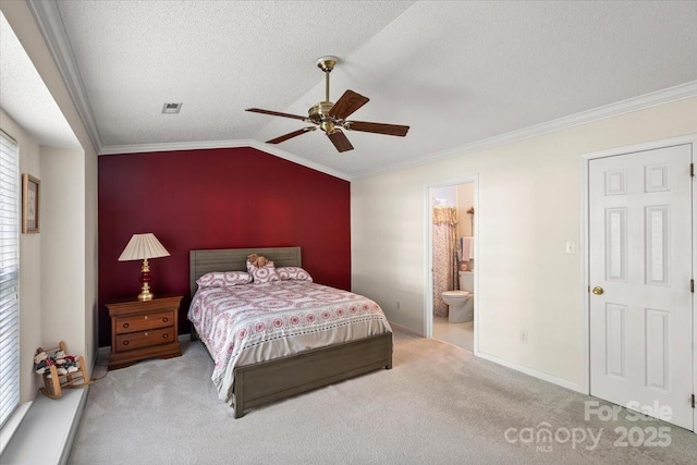 carpeted bedroom featuring crown molding, vaulted ceiling, a textured ceiling, and visible vents