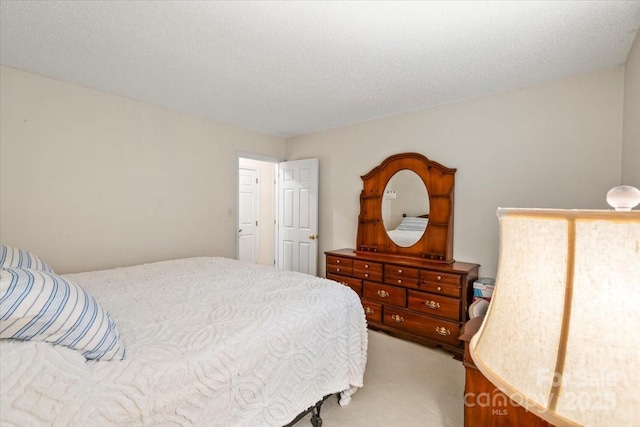 bedroom with light colored carpet