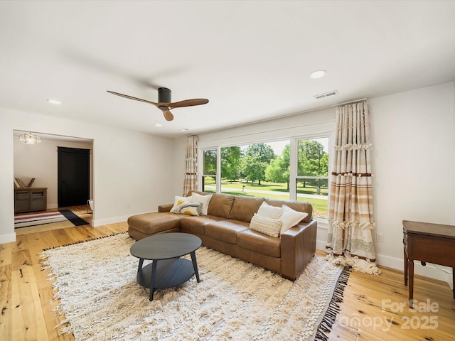 living area featuring a ceiling fan, baseboards, recessed lighting, wood finished floors, and visible vents