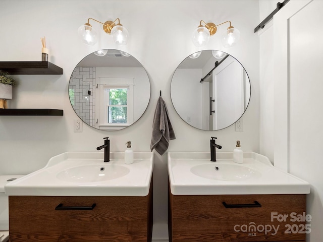 full bath featuring two vanities and a sink