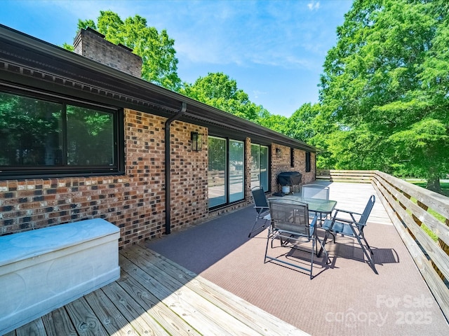 1207 Carlson Dr, Monroe, NC 28110 - wooden terrace featuring outdoor dining area and a grill