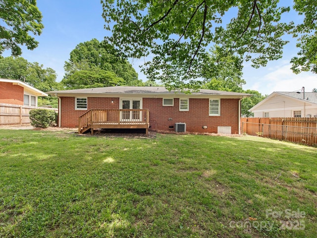 back of house featuring central air condition unit, a fenced backyard, a wooden deck, and brick siding