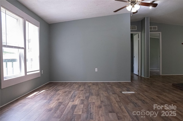 2844 Jamestown Rd Unit 2, Morganton, NC 28655 - empty room featuring plenty of natural light, ceiling fan, dark wood-style flooring, a textured ceiling, and vaulted ceiling