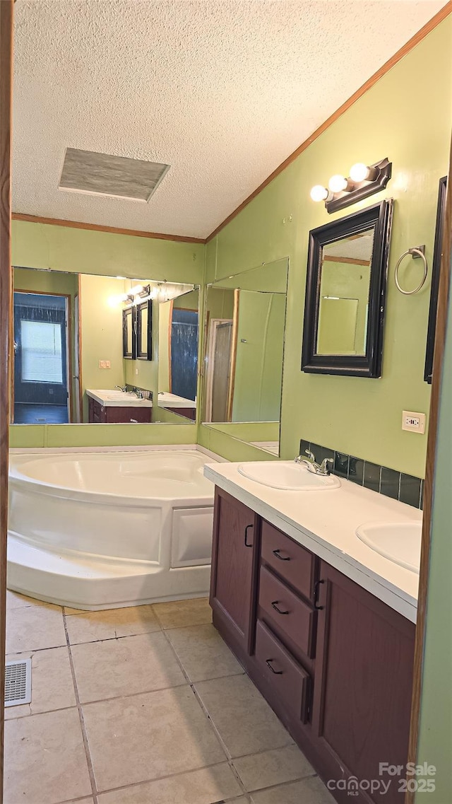 2844 Jamestown Rd Unit 2, Morganton, NC 28655 - bathroom with a textured ceiling, ornamental molding, tile patterned flooring, a bath, and a stall shower