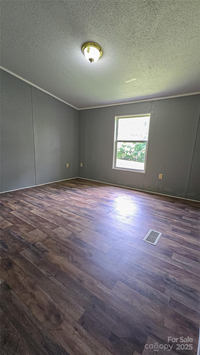 2844 Jamestown Rd Unit 2, Morganton, NC 28655 - spare room featuring dark wood-style flooring and a textured ceiling