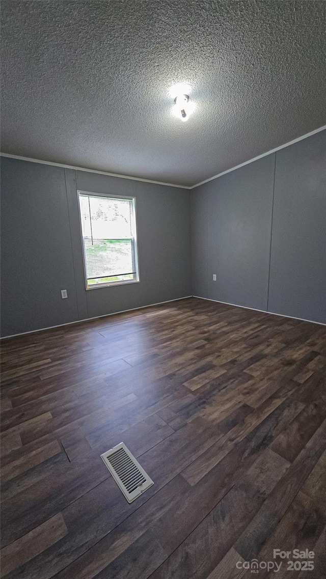 2844 Jamestown Rd Unit 2, Morganton, NC 28655 - unfurnished room featuring dark wood-style flooring and a textured ceiling