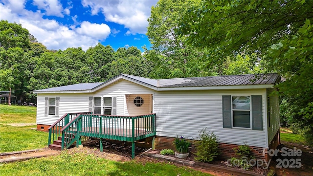 2844 Jamestown Rd Unit 2, Morganton, NC 28655 - manufactured / mobile home featuring a wooden deck, crawl space, metal roof, and a front lawn
