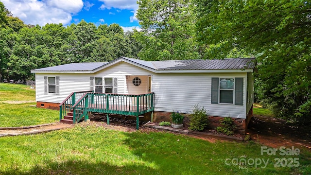 2844 Jamestown Rd Unit 2, Morganton, NC 28655 - manufactured / mobile home with crawl space, a deck, a front yard, and metal roof