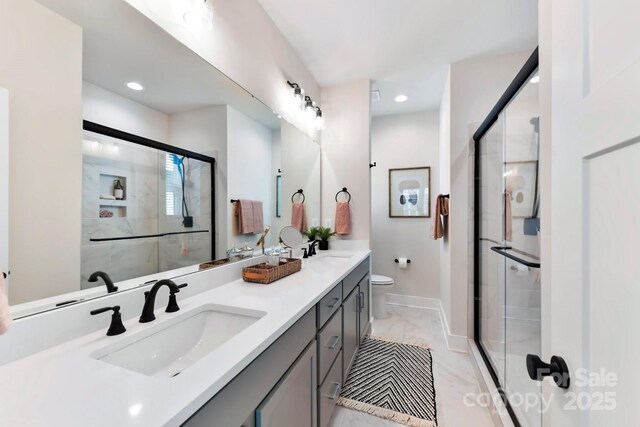316 S Turner Ave Unit 11, Charlotte, NC 28208 - bathroom featuring a sink, marble finish floor, and a stall shower