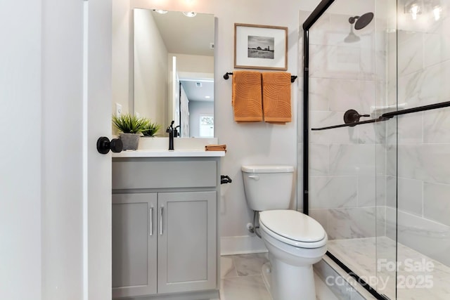 316 S Turner Ave Unit 11, Charlotte, NC 28208 - bathroom with vanity, toilet, marble finish floor, baseboards, and a shower stall