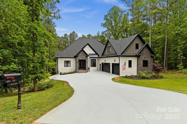 view of front of home featuring board and batten siding, a standing seam roof, driveway, a front lawn, and stone siding