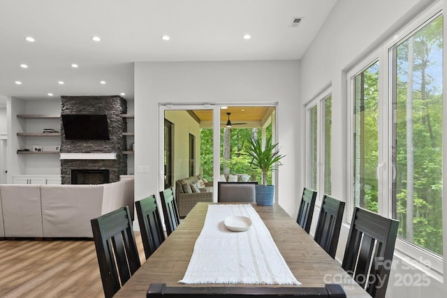 dining area with a ceiling fan, recessed lighting, wood finished floors, and visible vents