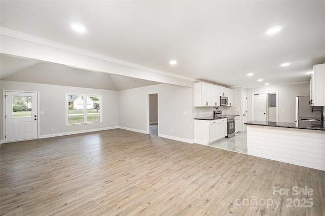 unfurnished living room with baseboards, ornamental molding, recessed lighting, and light wood-style flooring