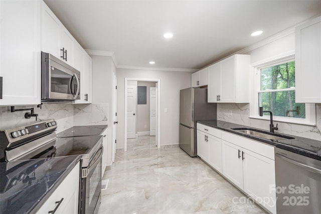 kitchen featuring backsplash, crown molding, a sink, stainless steel appliances, and recessed lighting