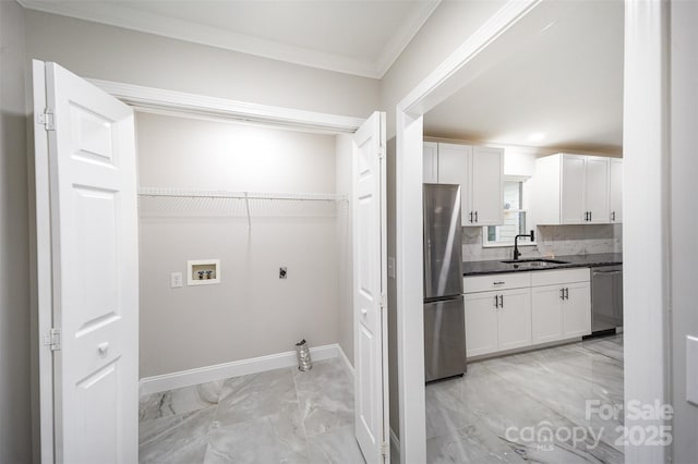 washroom featuring crown molding, a sink, hookup for a washing machine, marble finish floor, and hookup for an electric dryer