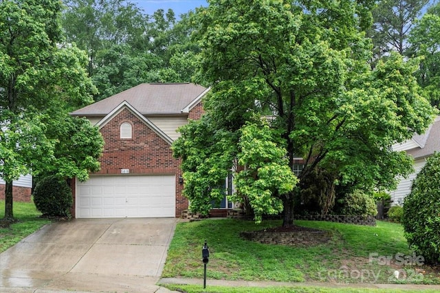 view of property hidden behind natural elements featuring concrete driveway, a garage, a front yard, and brick siding