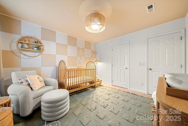 bedroom featuring baseboards and carpet