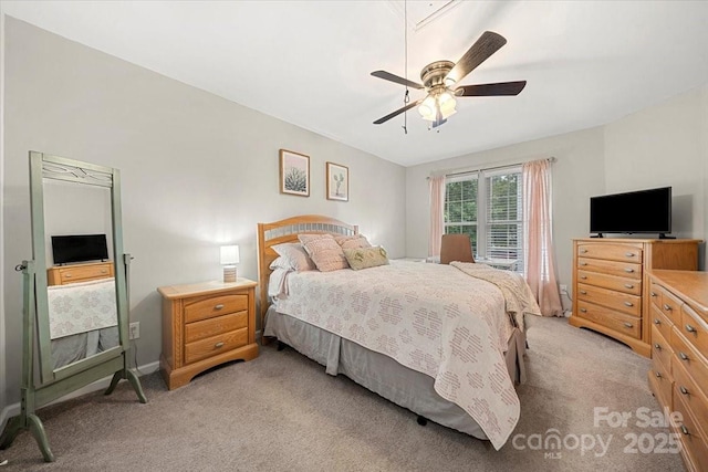 bedroom featuring light colored carpet and ceiling fan