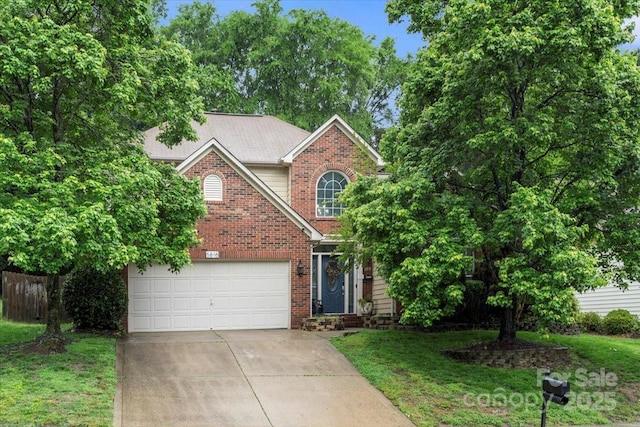view of front of home with driveway, brick siding, and an attached garage
