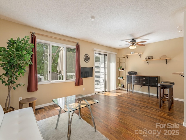 23 Hollybrook Dr, Asheville, NC 28803 - living room with a textured ceiling, ceiling fan, baseboards, and wood finished floors