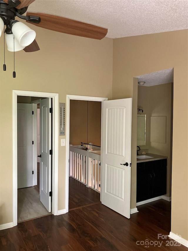23 Hollybrook Dr, Asheville, NC 28803 - interior space featuring baseboards, a sink, a textured ceiling, and wood finished floors