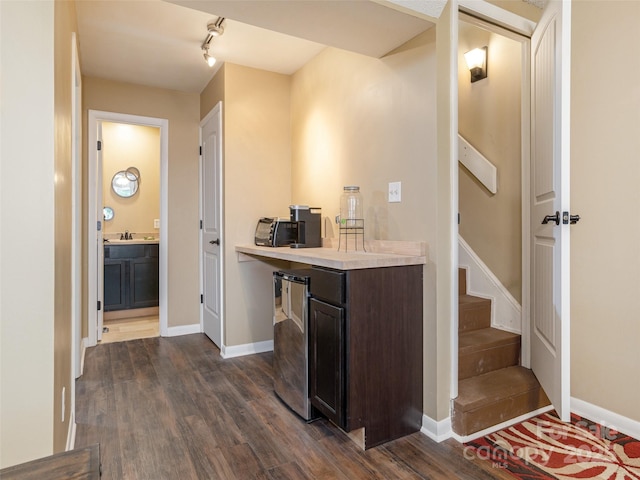 23 Hollybrook Dr, Asheville, NC 28803 - hall with baseboards, a sink, dark wood finished floors, and stairs