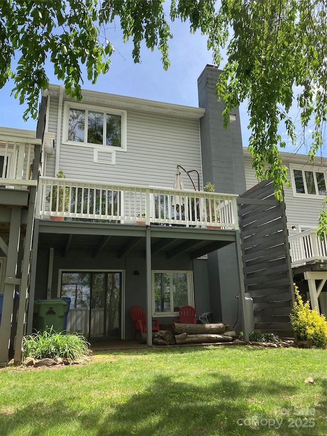 23 Hollybrook Dr, Asheville, NC 28803 - rear view of property featuring a wooden deck, a chimney, and a yard